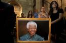 People attend a special Sunday service dedicated to Nelson Mandela at St. George's Cathedral in Cape Town