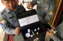 Police in Myanmar's Tamu district show a test kit used to identify pseudoephedrine in Myanmar's Chin State