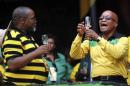 South Africa's president and leader of the ruling ANC party Zuma raises his glass next to Secretary General Mantashe during the party's 102nd anniversary celebration in Nelspruit