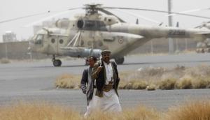 Shiite rebels, known as Houthis, walk on the tarmac &hellip;