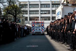 NYPD officers salute as an ambulance carrying the body &hellip;