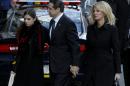 New York Gov. Andrew Cuomo, center, arrives with his girlfriend, Sandra Lee, right, and one of his daughters to the wake of his father, former New York Gov. Mario Cuomo, Monday, Jan. 5, 2015, in New York. (AP Photo/Seth Wenig)