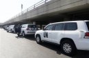 A convoy of cars of United Nations inspectors are seen arriving at Beirut airport
