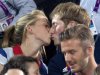 Gold medal-winning British cyclists Laura Trott and Jason Kenny kiss during the women's beach volleyball final during the London 2012 Olympic Games