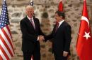 U.S. Vice President Biden shakes hands with Turkey's Prime Minister Davutoglu during their meeting in Istanbul