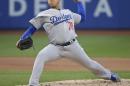 Los Angeles Dodgers' Julio Arias delivers a pitch during the first inning of a baseball game against the New York Mets on Friday, May 27, 2016, in New York. (AP Photo/Frank Franklin II)