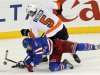 New York Rangers' Stralman dives to stop a shot by Philadelphia Flyers' Coburn in the third period of their NHL hockey game at Madison Square Garden in New York