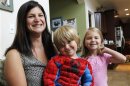 Sarah Formato, 31-year-old stay-at-home mom, poses with her children at her home in Aurora, Colorado