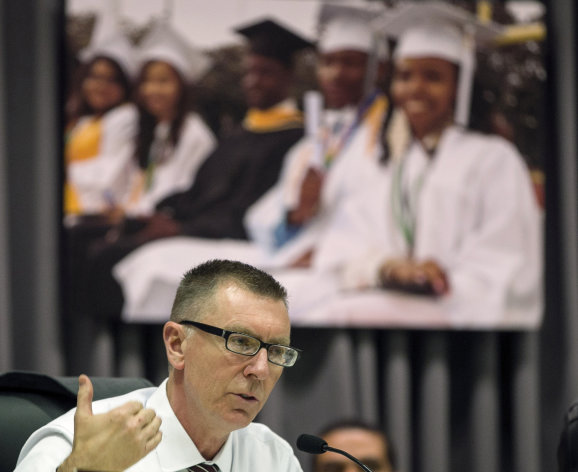 <p>               In this photo taken Tuesday, Jan. 15, 2013, The Los Angeles Unified School District Superintendent John Deasy explains the need to transform Crenshaw High School in South Los Angeles starting in the next academic year, after the board approved a drastic overhaul during a board meeting in Los Angeles. LAUSD's Crenshaw High School is currently one of California's lowest performing high schools. (AP Photo/Damian Dovarganes)
