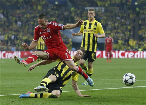 Bayern's Franck Ribery of France, foreground, in action, during the Champions League Final soccer match between Borussia Dortmund and Bayern Munich at Wembley Stadium in London, Saturday May 25, 2013