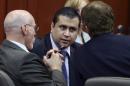 FILE - In this July 13, 2013, file photo, George Zimmerman, center, talks to his attorneys Don West, left, and Mark O'Mara during jury deliberations in his trial in Seminole circuit court in Sanford, Fla. Almost as soon as Zimmerman was pronounced "not guilty, the cry of protestors went up, that the U.S. government must get "justice for Trayvon," the unarmed black teenager Trayvon Martin, killed by Zimmerman. Attorney General Eric Holder, the first black man to lead the nation's law enforcement, says the Justice Department is investigating. But an investigation does not mean a case will move forward; these investigations can take months, even years, and are hard to prosecute. (AP Photo/Orlando Sentinel, Gary W. Green, Pool)
