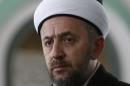In this photo taken Saturday, Jan. 3, 2015, Bosnian imam Selvedin Beganovic, 44, pauses during an interview with The Associated Press at the mosque in the village of Trnovi, near Velika Kladusa, 370 kilometers (230 miles) northwest of Sarajevo, Bosnia. For Beganovic, his compatriots have no business fighting in Syria no matter how many times Muslim extremists try to kill him for saying so. The imam has suffered seven assaults blamed on Muslim extremists in the past year - with three just in the past month. (AP Photo/Amel Emric)