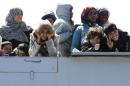 Migrants arrive at the Sicilian harbor of Augusta