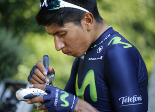 Colombia's Nairo Quintana adjusts his cycling shoes prior to a training session two days before the start of the Tour de France. (AP)