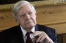 Former German Chancellor Helmut Schmidt smokes a cigarette during a luncheon at the Axel Springer publishing house in Berlin, on September 29, 2010