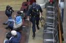 A police officer with a dog search bags at Union Station in Washington