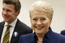 Lithuania's President Dalia Grybauskaite smiles in a office as she waits for the results of Lithuania's presidential election first round in Vilnius, Lithuania, Sunday, May 11, 2014. Dalia Grybauskaite is widely expected to be re-elected for a second term. (AP Photo/Mindaugas Kulbis)