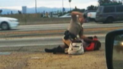 Video: Officer Beats Woman on LA Freeway